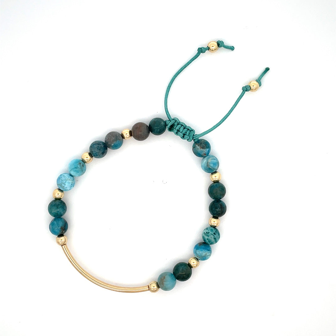 Close-up of natural apatite gemstone showing signature Summer Gems teal color