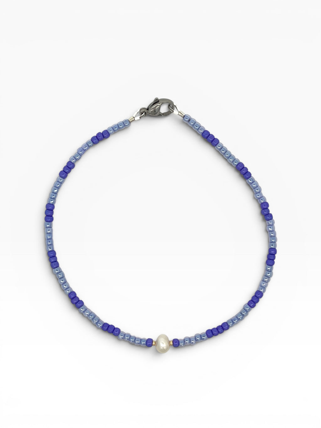 Beaded anklet  with a pearl on a white background