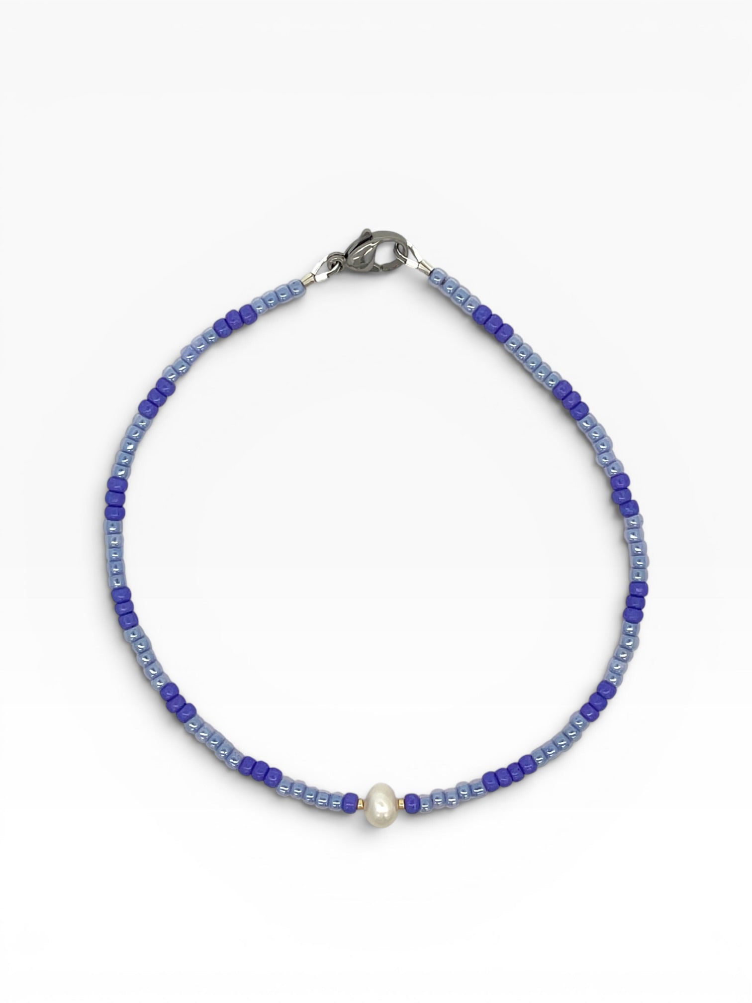 Beaded anklet  with a pearl on a white background