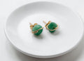 emerald stud in dish