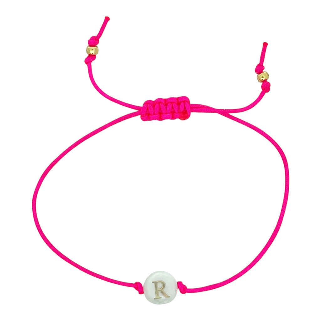 Pink bracelet with a white charm featuring the letter 'R' on a white background