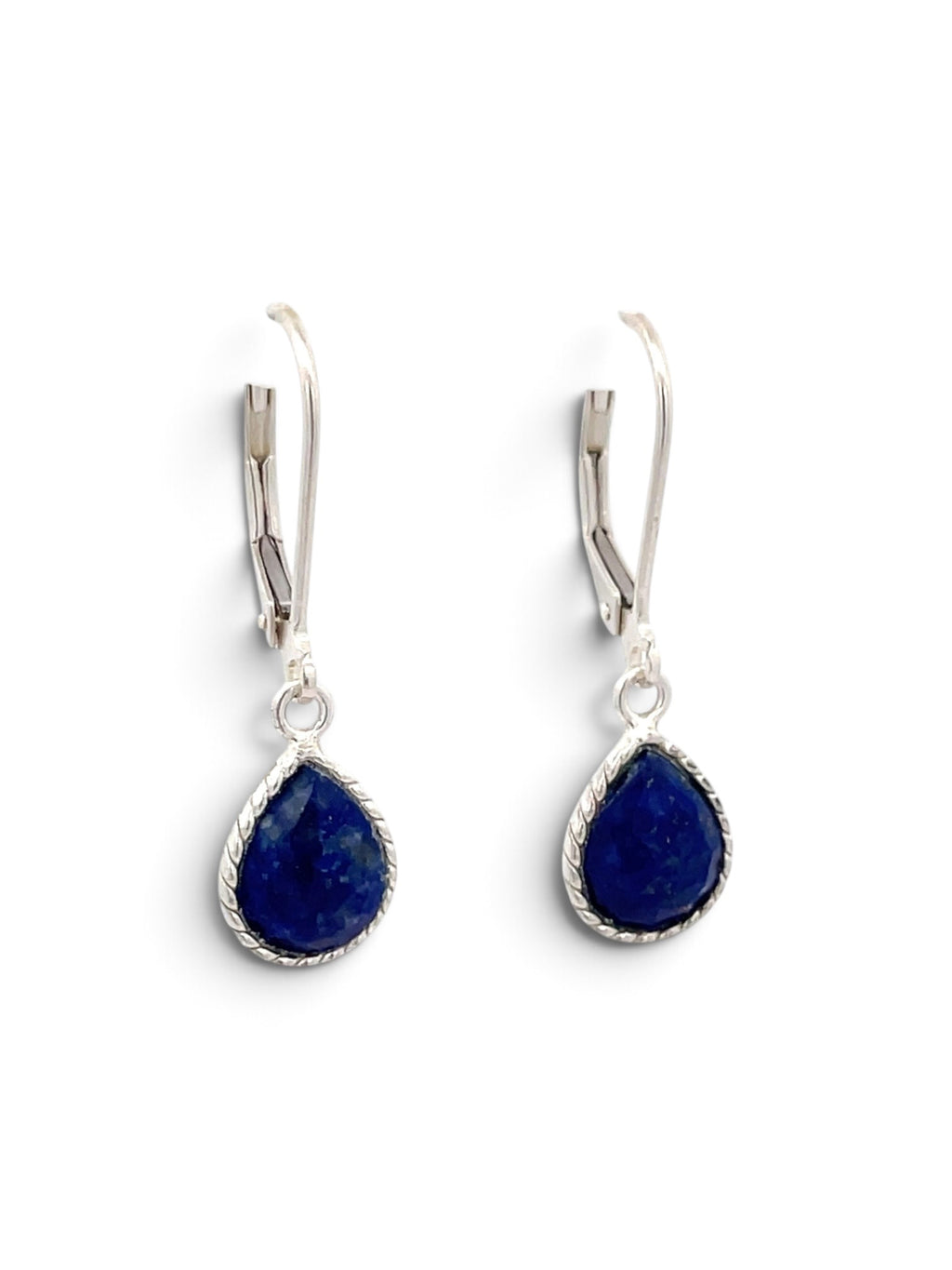 A pair of silver leverback drop earrings featuring teardrop-shaped deep blue lapis lazuli stones with a twisted border setting, shown on a plain white background.