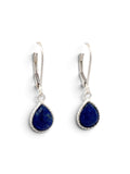 A pair of silver leverback drop earrings featuring teardrop-shaped deep blue lapis lazuli stones with a twisted border setting, shown on a plain white background.