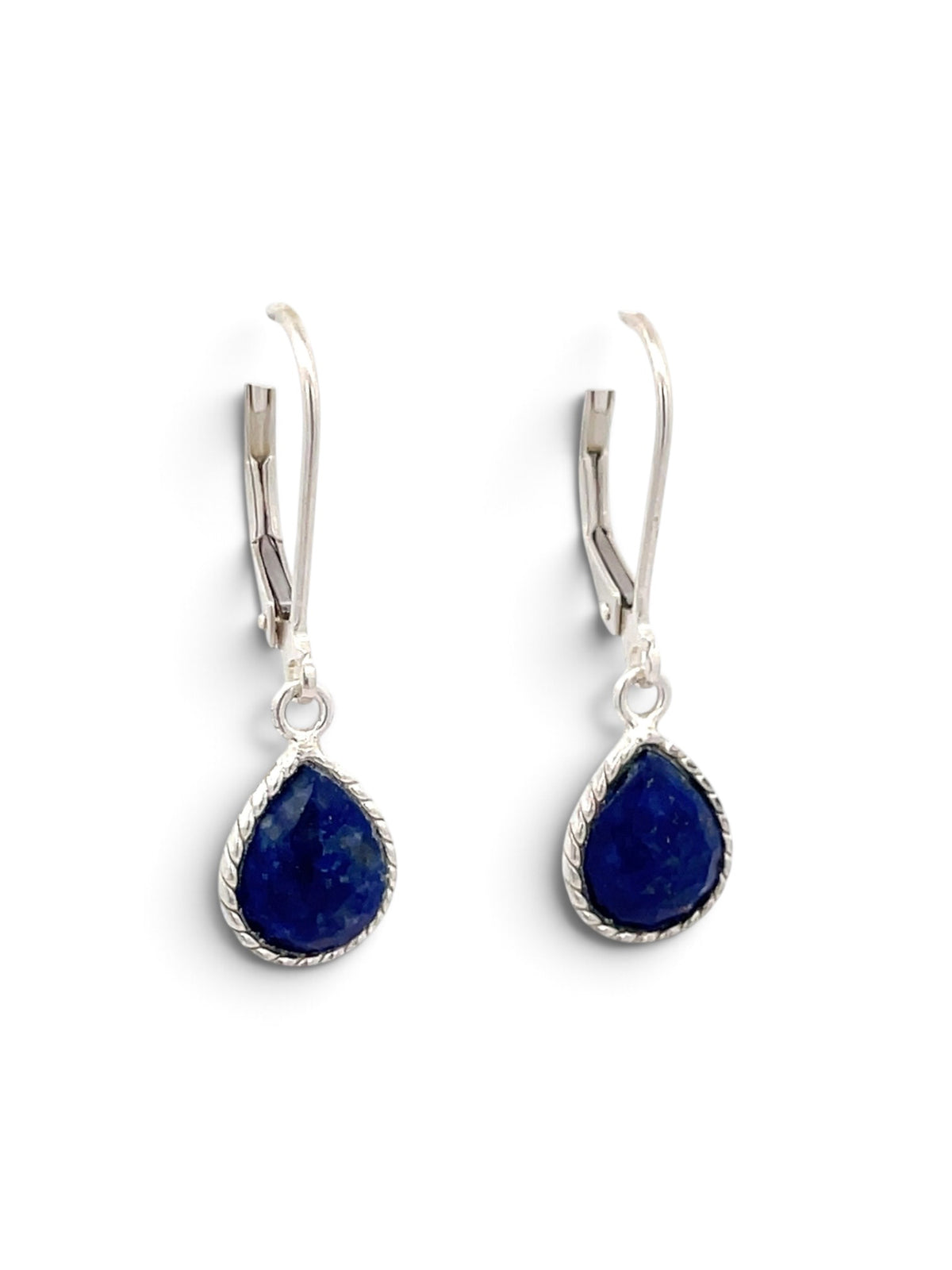 A pair of silver leverback drop earrings featuring teardrop-shaped deep blue lapis lazuli stones with a twisted border setting, shown on a plain white background.