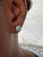 Load image into Gallery viewer, Marine gold studs on model 
