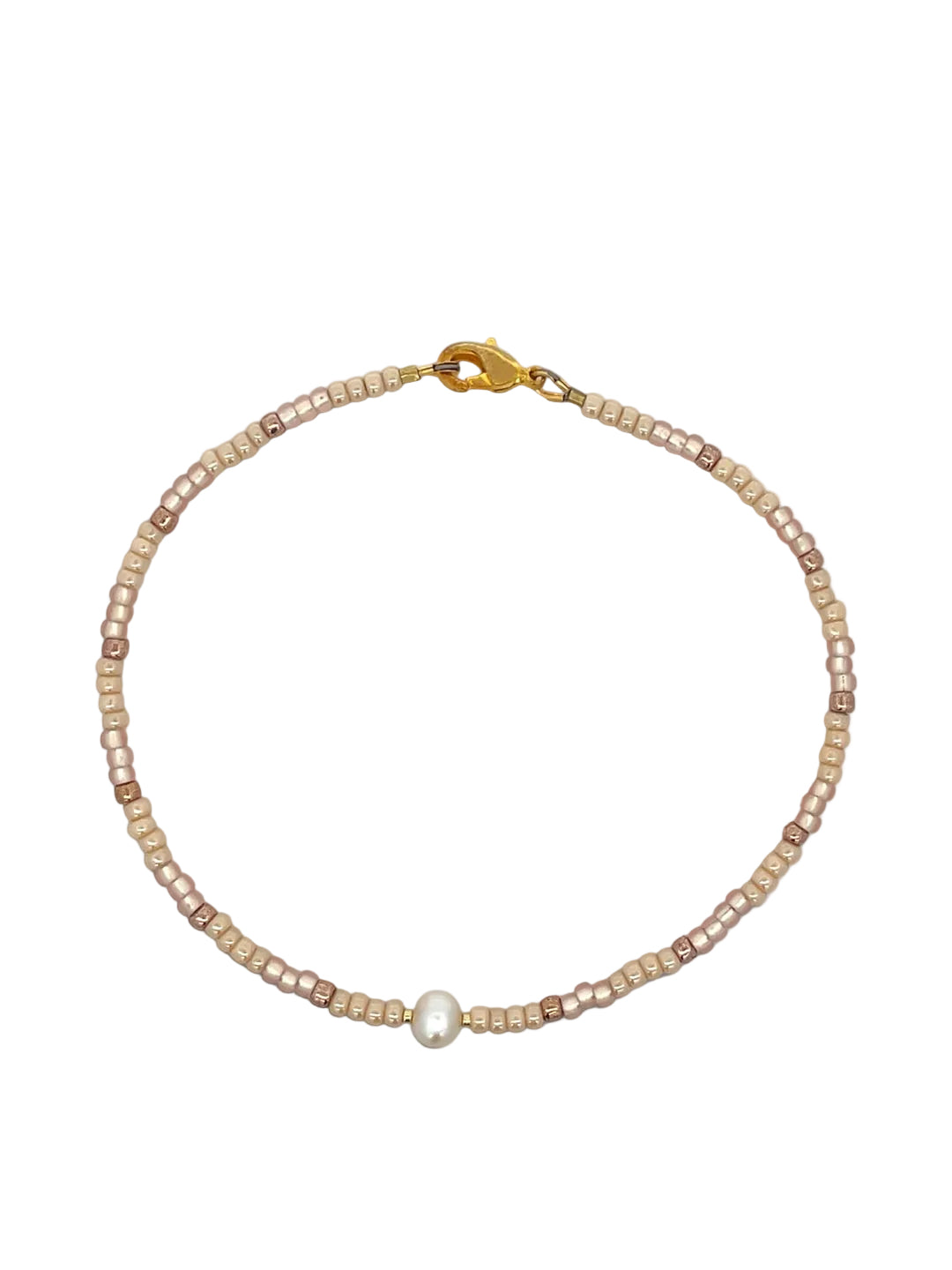 beige glass bead Pearl anklet with a gold clasp on a white background