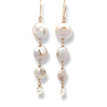 Pearl earrings with gold hooks on a white background