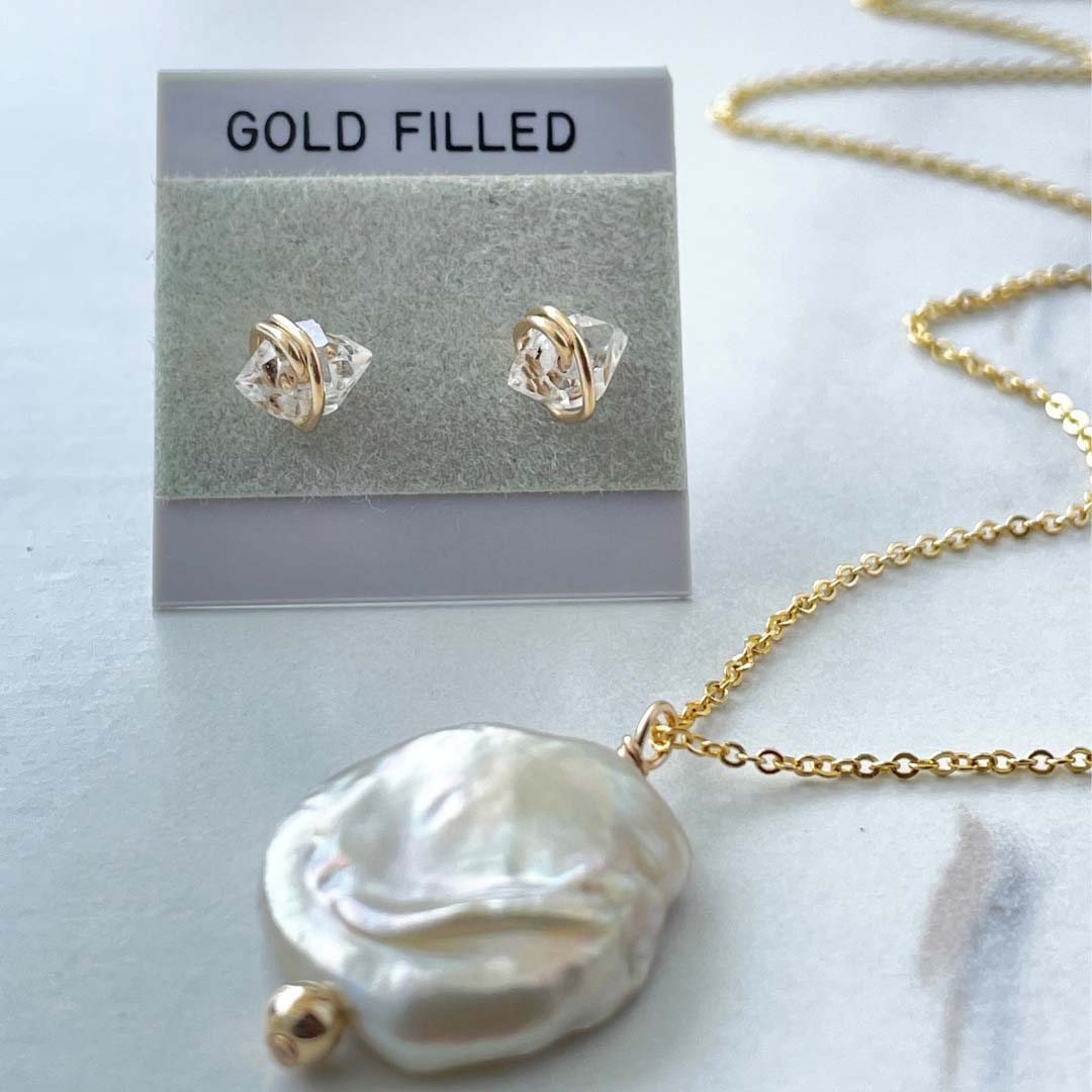 Freshwater pearl necklace and clear quartz stud earrings on gold-filled card 
