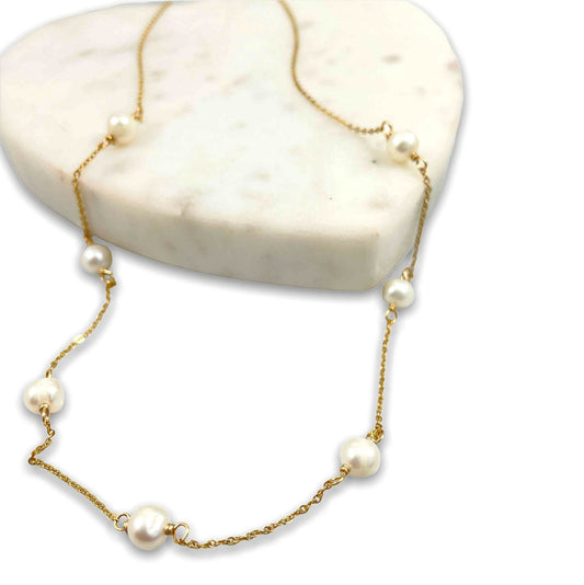 Pearl and chain necklace on a heart tile 