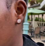 Load image into Gallery viewer, model in rose quartz stud earrings 
