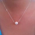 Floating pearl necklace in silver